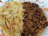 A picture of Dry fried githeri with steamed cabbage.