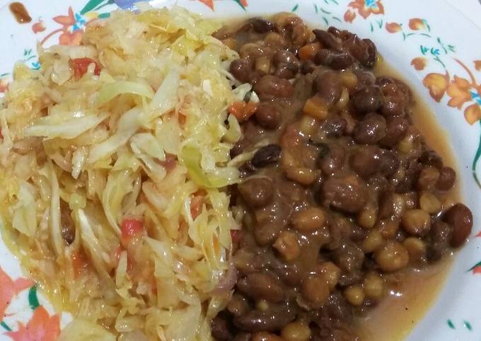 A picture of Dry fried githeri with steamed cabbage.