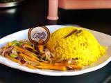 A picture of Yellow rice with stir vegetables.