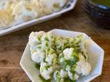 A picture of 🥦 Steamed cauliflower with green sauce.