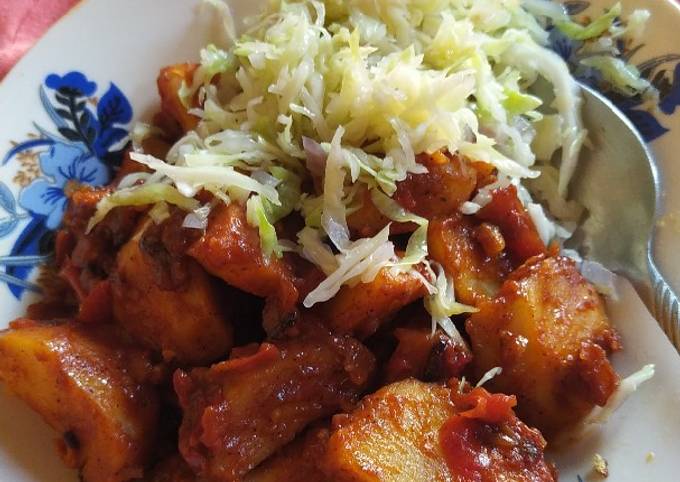 A picture of Masala potatoes and streamed cabbage.