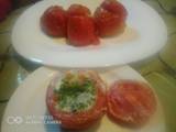 A picture of Oven baked stuffed tomatoes.