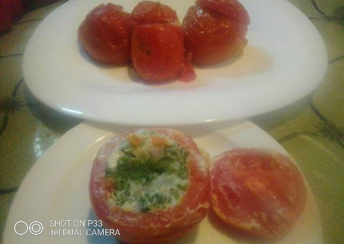 A picture of Oven baked stuffed tomatoes.