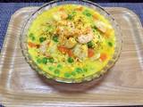 A picture of Curry shrimp with vegetable.