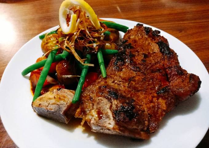 A picture of Steak and vegetables.