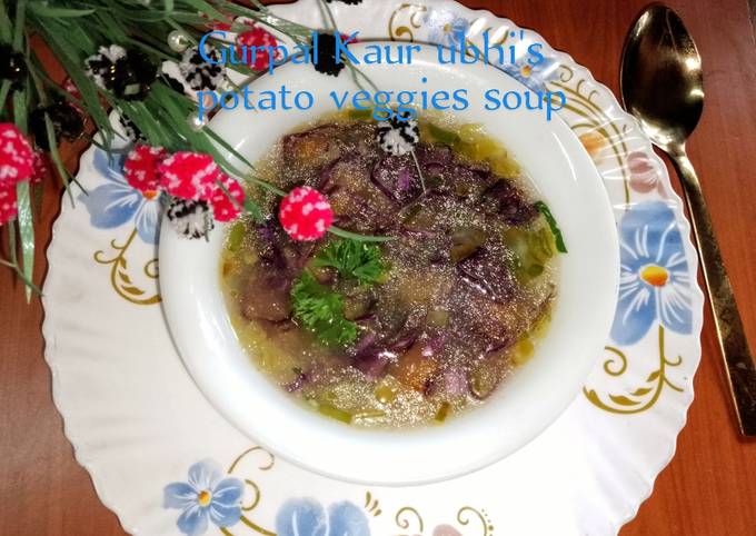 A picture of Potato veggies soup 🥔🥕🫛🥬.