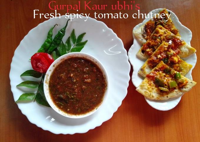 A picture of Fresh spicy tomato chutney 🍅🌿🌶️🧄.