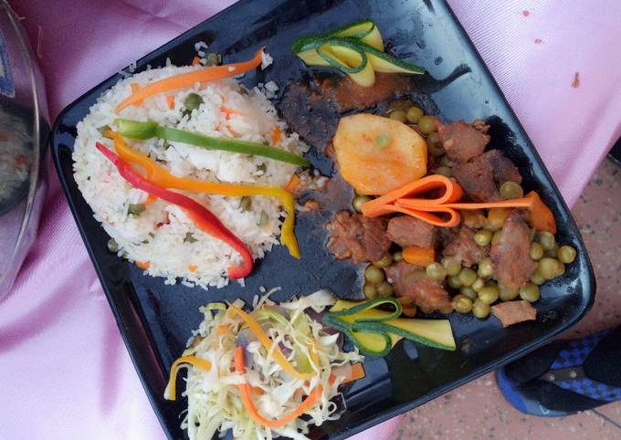 A picture of Irish Stew,vegetable rice and steamed cabbage.