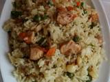 A picture of Chicken stir fry with rice and vegetables.