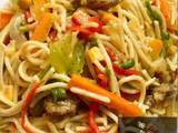 A picture of Fried spaghetti with vegetables and chopped beef.