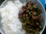 A picture of Rice served with beef Okra.