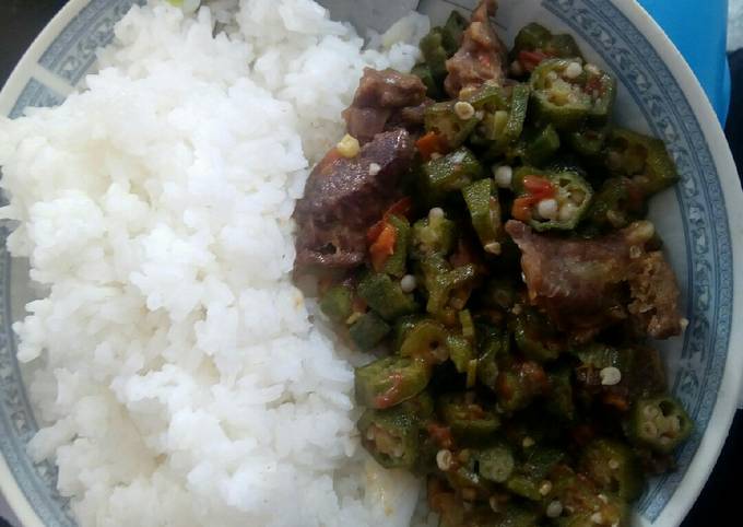 A picture of Rice served with beef Okra.