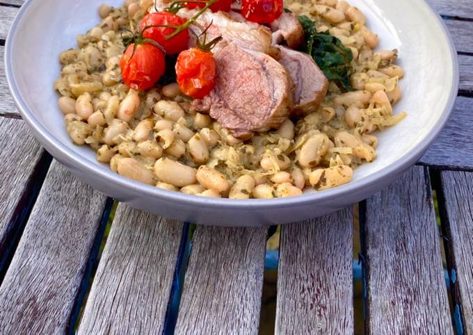 A picture of Zesty Pesto Beans with Dinosaur Kale and a rack of lamb.