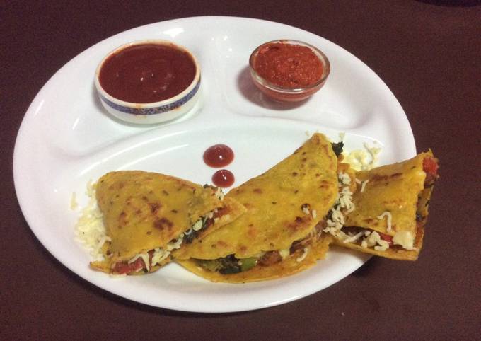 A picture of Vegetables stuffed besan chilla.