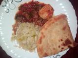 A picture of Beef stew, cabbage and chapati.