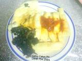 A picture of Fried yam, omelette and stir-fry leafy vegetables.