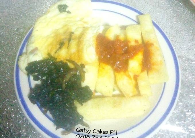 A picture of Fried yam, omelette and stir-fry leafy vegetables.