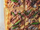 A picture of Summertime Red Onion, Asparagus & Prosciutto Tart.