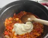 A picture of step 6 of Tomato Chicken Curry.