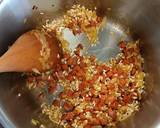 A picture of step 3 of Tomato and chorizo risotto with pan fried chicken supreme and pesto compound.