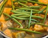 A picture of step 10 of Squash with French Beans in Coconut Milk.