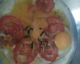 A picture of step 3 of Sunny side up Eggs with tomato.