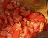 A picture of step 1 of Green beans (cumin, tomato + garlic).