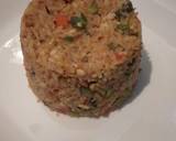 A picture of step 11 of Spicy vegetable rice with egg and sausage.