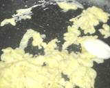 A picture of step 2 of Frying rice with egg and vegetables.