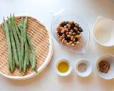 A picture of step 1 of Japanese vegetable dish, hot salad with beans and soy boiled with rice vinegar.