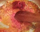 A picture of step 2 of Shakshouka (eggs in tomato and basil sauce).