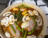 A picture of step 3 of Fish Curry with mushroom and asparagus.