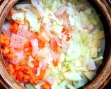 A picture of step 3 of Seabass with vegetables in the oven.