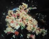 A picture of step 3 of Simple scrambled eggs with onions, tomatoes and capsicum.