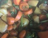 A picture of step 7 of Vegetable curry with carrots, carrot tops, potatoes and spinach.