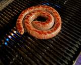 A picture of step 1 of Boerewors with mashed potatoes served with a tomato chili relish.