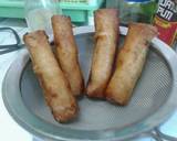 A picture of step 8 of Savory pork and vegetable egg roll.