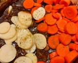 A picture of step 4 of Beef stew in a Dutch Oven.