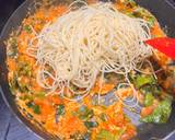 A picture of step 6 of #CookEveryPart Stir-fry noodles with leek tops and spring greens.