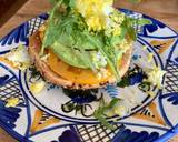 A picture of step 4 of Tomato and avocado on toasted bagel with grated egg.