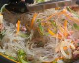 A picture of step 7 of Japchae - Korean vermicelli with meat and vegetables.