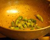 A picture of step 5 of Fried rice topped with green veggies.