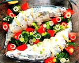 A picture of step 8 of Mackerel in sour cream, with broccoli and tomatoes, in the oven.