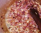 A picture of step 1 of Pilau served with cabbage and salad.