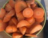 A picture of step 5 of Vegetable curry with carrots, carrot tops, potatoes and spinach.