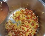 A picture of step 2 of Tomato and chorizo risotto with pan fried chicken supreme and pesto compound.