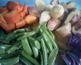 A picture of step 2 of Ginger, garlic and rosemary vegetables.