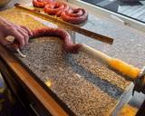 A picture of step 1 of Boerewors with mashed potatoes served with a tomato chili relish.