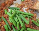 A picture of step 6 of Green beans (cumin, tomato + garlic).