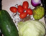 A picture of step 6 of Pilau served with cabbage and salad.